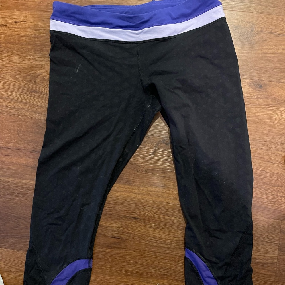 Lululemon cropped black dotted leggings with purple waist band, size 10